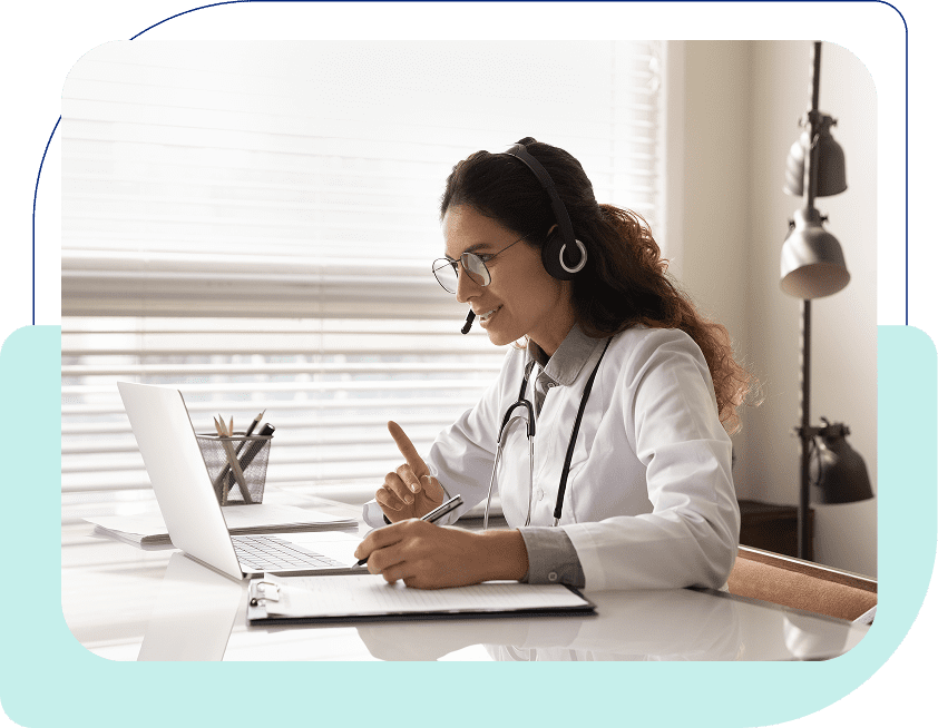 Doctor conducting a virtual consultation on laptop.